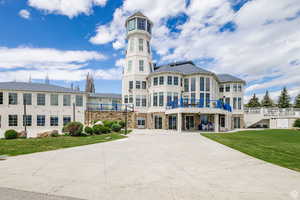 View of building exterior with concrete driveway