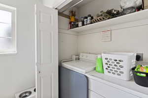Laundry area featuring independent washer and dryer