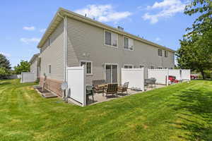Rear view of property with a patio, outdoor lounge area, and brick siding