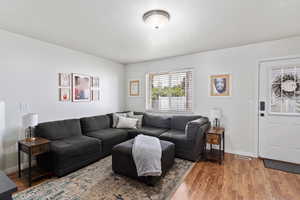 Living room with wood finished floors and baseboards