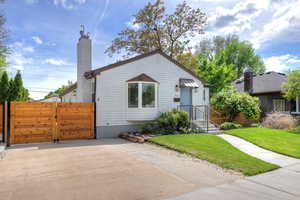Bungalow-style home featuring a Fireplace and a gate
