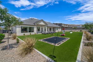 Rear view of property featuring stucco siding and a tile roof
