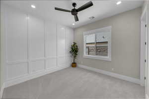 Unfurnished room with light colored carpet, ceiling fan, recessed lighting, and baseboards
