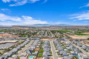 Aerial view of residential area featuring a mountain backdrop