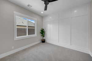 Empty room featuring ceiling fan, light colored carpet, baseboards, and recessed lighting