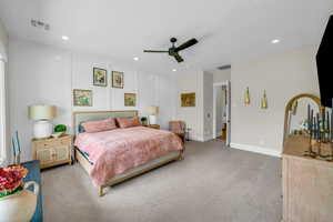 Bedroom featuring light colored carpet, recessed lighting, baseboards, and ceiling fan