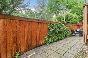 View of patio with a fenced backyard