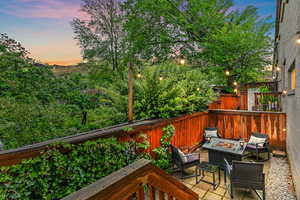 Deck at dusk with a fire pit