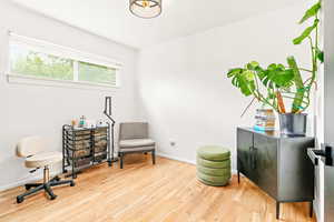Sitting room featuring wood finished floors and baseboards