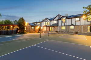 View of tennis court featuring basketball court