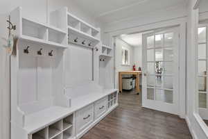Mudroom with dark wood finished floors