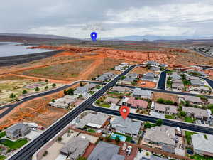 View of property location featuring nearby suburban area and a water and mountain view