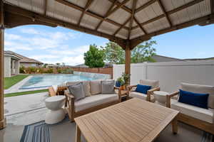 View of patio featuring outdoor lounge area, a fenced backyard, and a gazebo