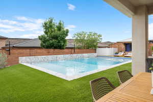 View of swimming pool featuring a pool with connected hot tub