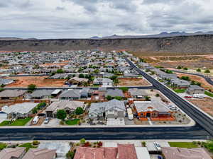 Aerial view of residential area featuring a mountainous background