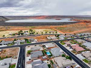 Aerial perspective of suburban area with a nearby body of water