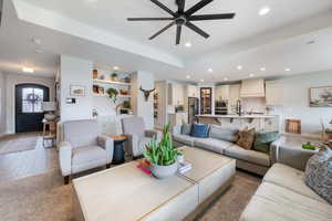 Living room with recessed lighting, ceiling fan, and baseboards