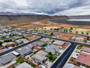 Aerial perspective of suburban area featuring a water and mountain view