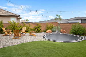 View of yard featuring a trampoline