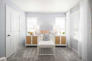 Bedroom with carpet flooring and baseboards