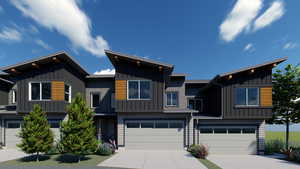 View of front of house featuring an attached garage, board and batten siding, and concrete driveway