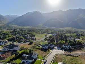 Aerial perspective of suburban area featuring a mountain backdrop