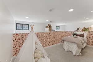 Bedroom featuring recessed lighting, baseboards, and carpet floors