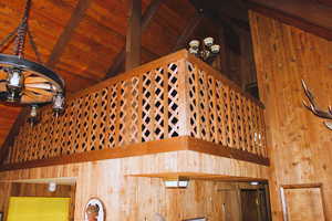 Detailed view of wood walls and beamed ceiling