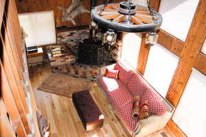 Detailed view of wood finished floors and a wood stove