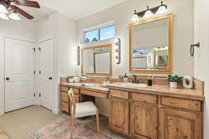 Bathroom featuring ceiling fan and vanity