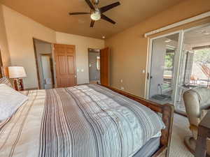 Bedroom featuring ceiling fan and access to exterior