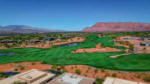 Aerial view featuring a water and mountain view, golf course view, and a residential view