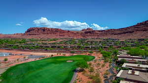 Birds eye view of property featuring golf course view, a residential view, and a mountain view
