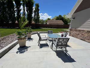 View of patio / terrace featuring outdoor dining space and central AC unit