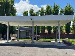 View of car parking featuring fence