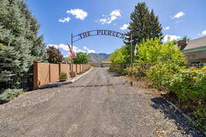 View of dirt / gravel road with a mountain view