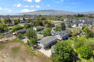 Aerial perspective of suburban area with a mountainous background