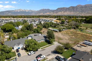 Aerial view of residential area featuring a mountainous background