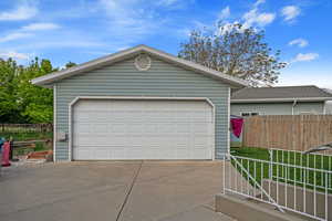 Garage featuring fence