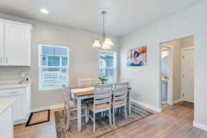 Dining area with light LVP flooring,
