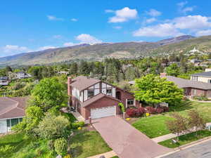 Aerial perspective of suburban area featuring a mountainous background