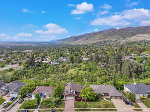 Aerial view of residential area featuring a mountain backdrop
