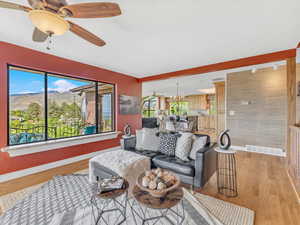 Living area featuring baseboards and plenty of natural light