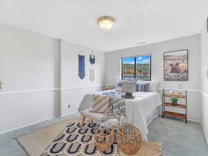 Carpeted bedroom with baseboards