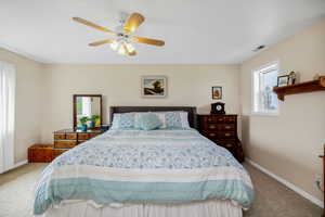 Master Bedroom with carpet floors, baseboards, and ceiling fan