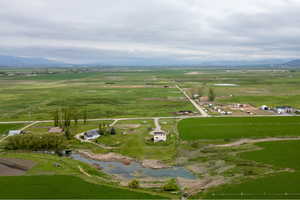 Aerial overview of property's location with rural landscape and a mountain backdrop