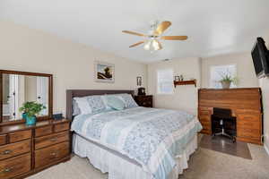 Master Bedroom with a desk and a ceiling fan