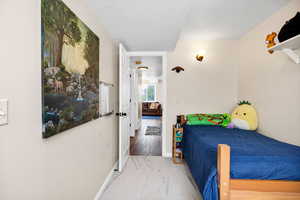 Basement Bedroom with carpet flooring and baseboards