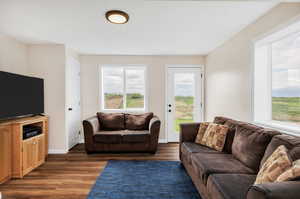 Basement walk out Living area featuring wood finished floors and baseboards.  Plumbed for a kitchenette