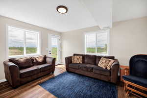 Basement Living area with wood finished floors